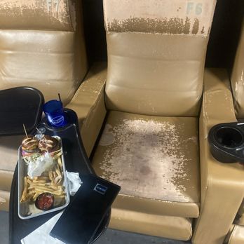 Studio Movie Grill - Cracked and worn out seats. Lousy food. - Cinema Near Me - Bakersfield, California Studio Movie Grill - Cracked and worn out seats. Lousy food. - Cinema Near Me - Bakersfield, California