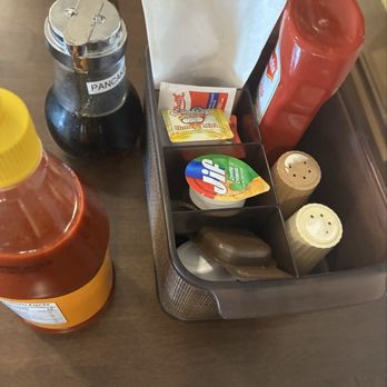 Ramada by Wyndham Stettler - Table stacked for toppings and sauce - Hotels Near Me - Stettler, Alberta
