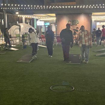 Chicken N Pickle - Enjoying corn hole! - Pickleball Near Me - Glendale, Arizona