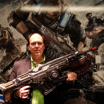 Microsoft Company Store - Holding a Gears of War toy gun that was for sale at the visitor center gift shop - Computers Near Me - Redmond, Washington
