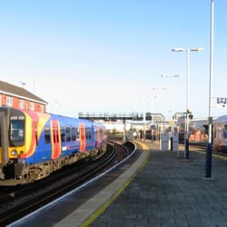 Fratton Station - Waterloo - bound train leaves from platform 1 (left) while a train from Waterloo waits to leave for Portsmouth Harbour from