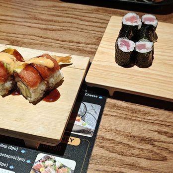 Raku Sushi Hibachi AYCE Buffet - Didn't get a chance to take the picture before eating. Salmon and tuna roll. Manhattan roll. - Japanese Near Me - Duluth, Georgia