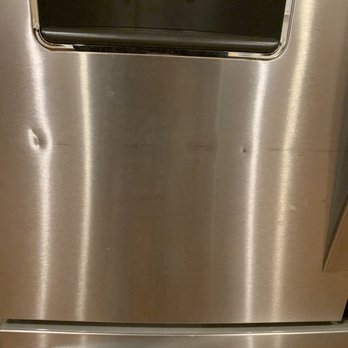 Razorback Moving - Fridge was damaged by trying to push through a doorframe that was too small. - Movers Near Me - Rogers, Arkansas