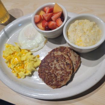 The Toasted Yolk Cafe - This was one of the breakfast platter options comes with eggs your way meeat of your choice grits or hashbrowns and cup of fruit - Breakfast & Brunch Near Me - Mont Belvieu, Texas The Toasted Yolk Cafe - This was one of the breakfast platter options comes with eggs your way meeat of your choice grits or hashbrowns and cup of fruit - Breakfast & Brunch Near Me - Mont Belvieu, Texas