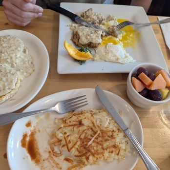 Pete's Egg Nest - Hash browns, over easy eggs with fried chicken, biscuits and gravy on the side with a fruit cup. - Breakfast & Brunch Near Me - Seattle, Washington Pete's Egg Nest - Hash browns, over easy eggs with fried chicken, biscuits and gravy on the side with a fruit cup. - Breakfast & Brunch Near Me - Seattle, Washington