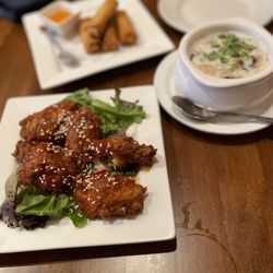 Banana Blossom Thai Cuisine - Sweet Chili Wings, coconut soup, and crispy rolls in the background