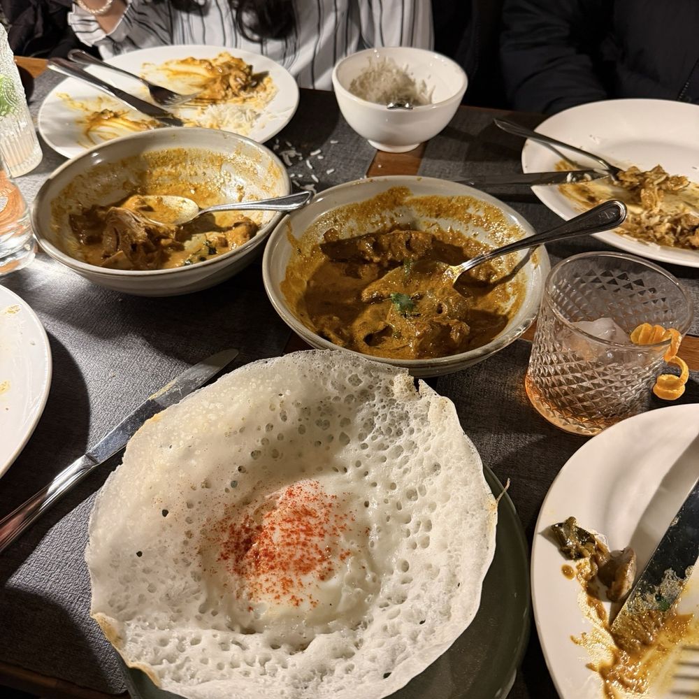 Egg hopper, Kori Ghassi curry (chicken) at the back, Chef's special goat curry in the middle