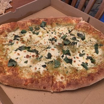 MidPoint Wine Bar & Restaurant - Oval shaped pesto pizza. - Pizza Near Me - Latham, New York MidPoint Wine Bar & Restaurant - Oval shaped pesto pizza. - Pizza Near Me - Latham, New York