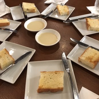 MW Restaurant - Round of complimentary focaccia - New American Near Me - Honolulu, Hawaii