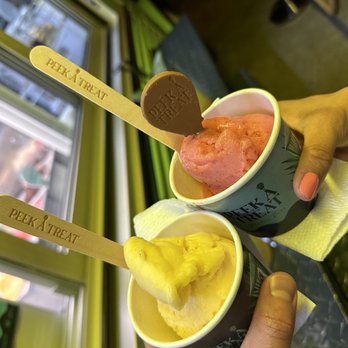 Peek A Treat - a person holding two cups of ice cream - Food Trucks Near Me - Miami, Florida