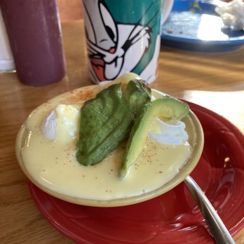 Little Cheerful Cafe - Three poached eggs in amazing hollandaise. Avocado as a garnish - Breakfast & Brunch Near Me - Bellingham, Washington Little Cheerful Cafe - Three poached eggs in amazing hollandaise. Avocado as a garnish - Breakfast & Brunch Near Me - Bellingham, Washington