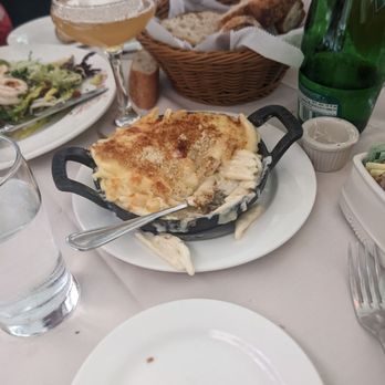 Parc - Mac and cheese, bread basket, the bottle of sparkling water, and the drink is a racecar - French Near Me - Philadelphia, Pennsylvania Parc - Mac and cheese, bread basket, the bottle of sparkling water, and the drink is a racecar - French Near Me - Philadelphia, Pennsylvania