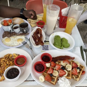 Que Huevos - Breakfast spread "chorizo eggs,waffles,steak and eggs,side of avocado & bacon) - Breakfast & Brunch Near Me - Playa del Carmen, ROO Que Huevos - Breakfast spread "chorizo eggs,waffles,steak and eggs,side of avocado & bacon) - Breakfast & Brunch Near Me - Playa del Carmen, ROO