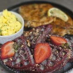 Tootsies Everything Waffle - Red velvet waffle with pork chops and eggs