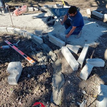 GroundScape Solutions - Placing the stone border - Landscaping Near Me - Haltom City, Texas