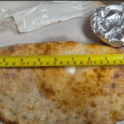 Nelly's Grill & Pizzeria - CALZONE LEFT TO RIGHT