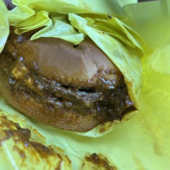 Big Tomy's - Pro tip, Lick off all of the chili bits on the parchment paper before you dive in unless you want chili everywhere but your mouth - Burgers Near Me - Los Angeles, California