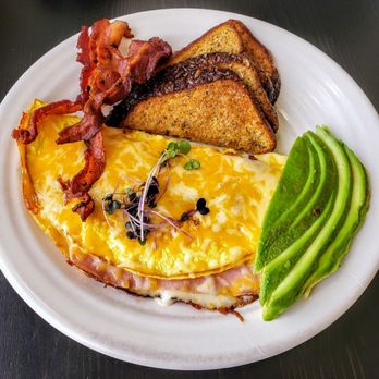 Johntin Café - Classic Ham and Cheese Omelette accompanied by Avocado, Bacon and Multigrain Toast at JohnTin - Coffee & Tea Near Me - Ponce, Puerto Rico Johntin Café - Classic Ham and Cheese Omelette accompanied by Avocado, Bacon and Multigrain Toast at JohnTin - Coffee & Tea Near Me - Ponce, Puerto Rico