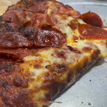 Rusty's Pizza Parlor - a slice of pepperoni pizza - Pizza Near Me - Bakersfield, California
