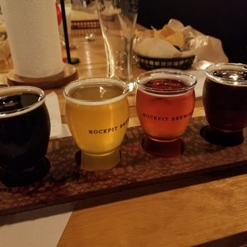 Rockpit Brewing & Distilling - From left to right: black strap milk stout, Waimea IPA, Strawberry Cider, Darth Malt Legs Schwarzbier ($10). - Breweries Near Me - Orlando, Florida Rockpit Brewing & Distilling - From left to right: black strap milk stout, Waimea IPA, Strawberry Cider, Darth Malt Legs Schwarzbier ($10). - Breweries Near Me - Orlando, Florida