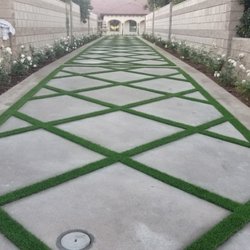 RC Concrete Engineering - Exposed aggregate color concrete with band around perimeter and diamond cut in the inside.