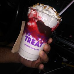 Hot fudge sundae with strawberry. Hot fudge sundae with strawberry.