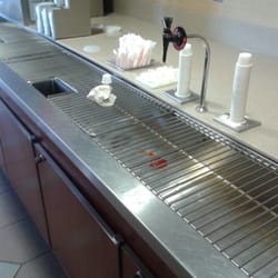 McDonald's - Nasty condiments counter. Under trained staff don't know anything about menu.