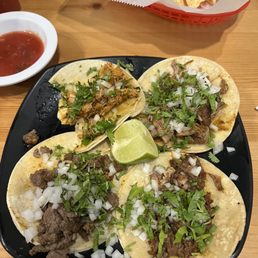 Top left : chicken taco. Top right : fried pork taco. Bottom left : steak taco. Bottom right : barbacoa taco. Top left : chicken taco. Top right : fried pork taco. Bottom left : steak taco. Bottom right : barbacoa taco.