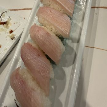 Sakura - Hamachi Nigiri with mostly rice. - Sushi Bars Near Me - Kapolei, Hawaii Sakura - Hamachi Nigiri with mostly rice. - Sushi Bars Near Me - Kapolei, Hawaii