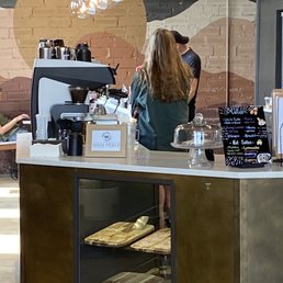 a woman working behind the counter