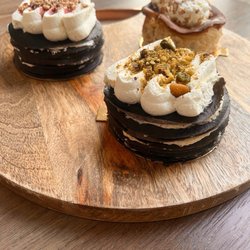 Fromagio's Artisan Cheese - Pistachio mini crepe cake, strawberry mini crepe cake, caramel apple basque cheesecake