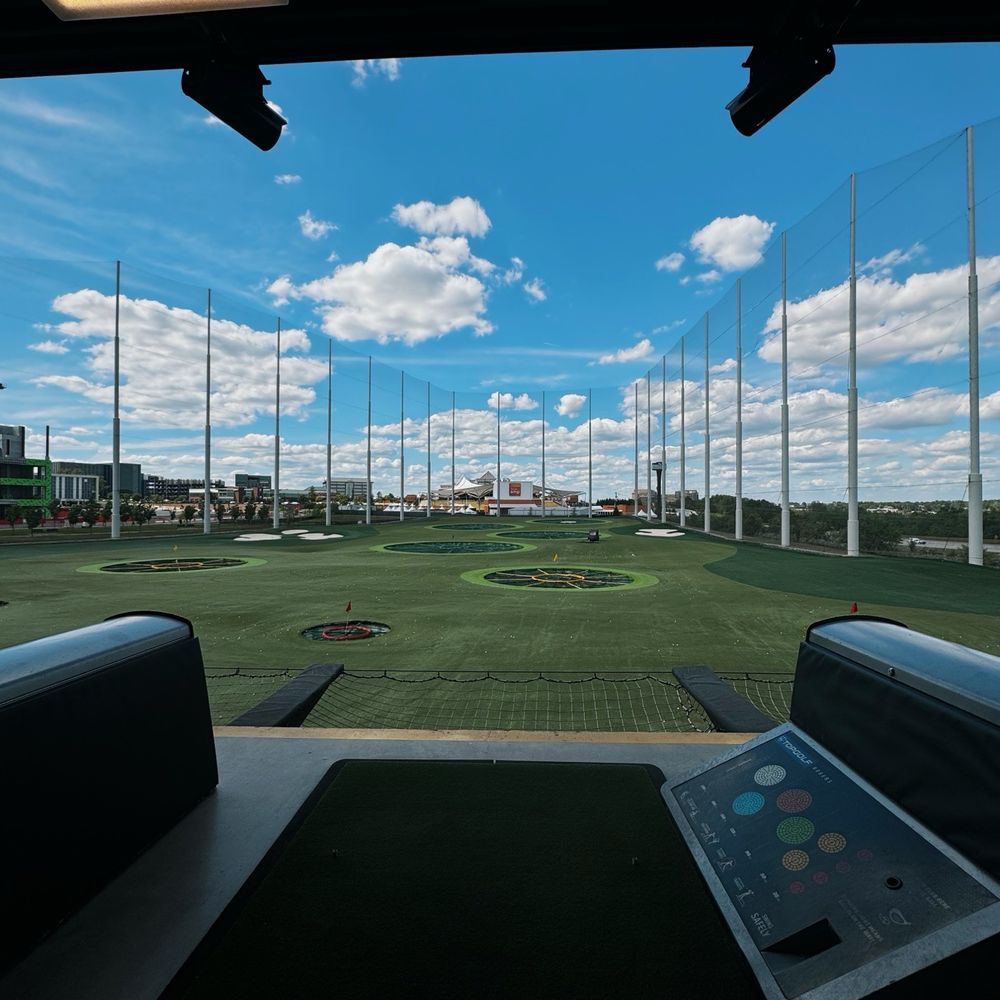 Topgolf - Great weather with vibrant greens - New American Near Me - Rogers, Arkansas