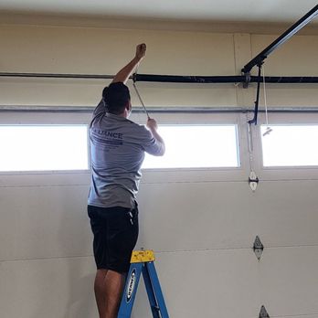 Alliance Overhead Doors - Installing and setting the new spring rates. - Garage Door Services Near Me Alliance Overhead Doors - Installing and setting the new spring rates. - Garage Door Services Near Me