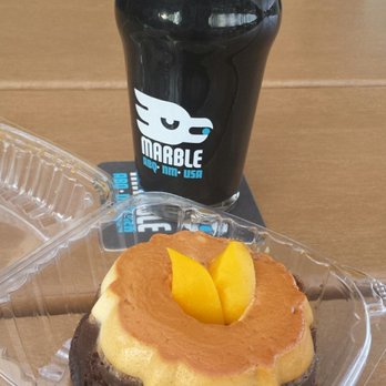 Marble Brewery Westside Tap Room - A pint of roasty grain flavored Marble stout, plus a chocolate flan from the Rio Tacos food truck. - Breweries Near Me - Albuquerque, New Mexico