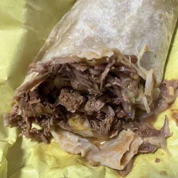 Rick's In & Out - A juicy burrito. Don't tilt it too much. - Breakfast & Brunch Near Me - Gardena, California