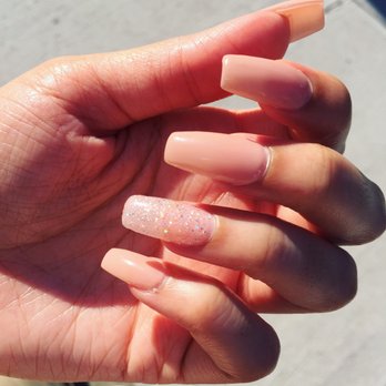 Glitz Nail - Natural gel polish with Sparkly gel polish on the ring finger - Waxing Near Me - New York, New York