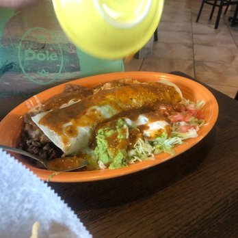 La Cabaña - Burrito being covered in hot salsa. - Mexican Near Me - Valparaiso, Indiana