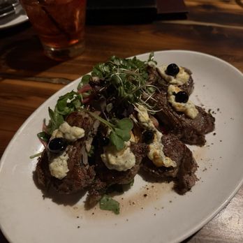 Prime Steakhouse - Lamb Lollipops, well cooked, loved the Gorgonzola cheese on top and the accompanied micro green salad - Bars Near Me - Redmond, Washington