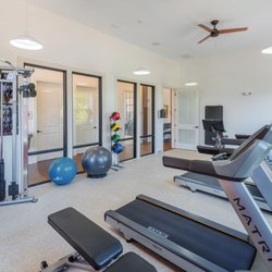 Riverside Flats at Aberfoyle Village - Fitness Center featuring a Peloton and free weights