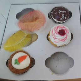 Almond joy, raspberey and carrot cake plus empty wrappers Almond joy, raspberey and carrot cake plus empty wrappers