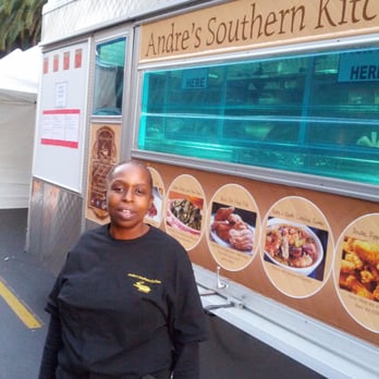 Andre's Southern Kitchen - a woman standing in front of a food truck - Southern Near Me Andre's Southern Kitchen - a woman standing in front of a food truck - Southern Near Me
