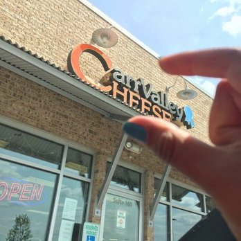 Carr Valley Cheese - a person's finger in front of a store - Cheese Shops Near Me - Sauk City, Wisconsin Carr Valley Cheese - a person's finger in front of a store - Cheese Shops Near Me - Sauk City, Wisconsin