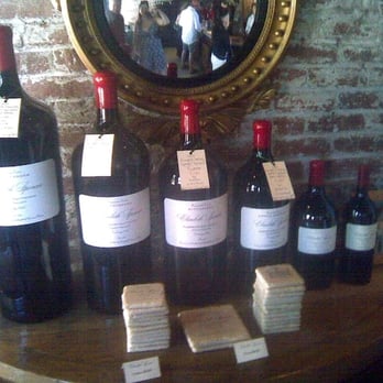Elizabeth Spencer Winery - Cute graduated sized bottles in the entry way - Wineries Near Me - Rutherford, California