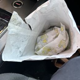 Sloppy ripped bag with raw egg in it