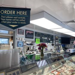 Sandy's Fish and Chips - Inside view of Sandy's Fish and Chips along with a view of John's Fish Market