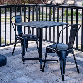 Affordable Seating - Patio Tolix-style chairs in distressed black (#337-DIB) with outdoor metal folding tables (#ODMF). - Furniture Stores Near Me - Chicago, Illinois