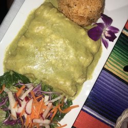 Akbar restaurant and Banquet Hall - Chicken enchiladas in green sauce. Not sure what green sauce is but it's delicious lol