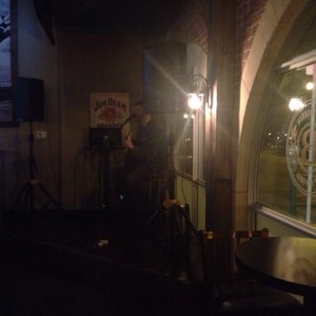 The Bourbon Tap & Grill - a man playing guitar - Pizza Near Me - Windsor, Ontario