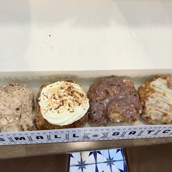 Parlor Doughnuts - Sandy Beach, Coconut Cream Filled, Blueberry Hill and Honey Glazed (left to right) - Coffee & Tea Near Me - Okatie, South Carolina