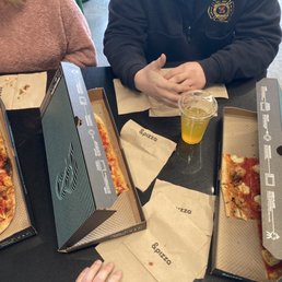 Crowded table but crowded with good pizza. Crowded table but crowded with good pizza.